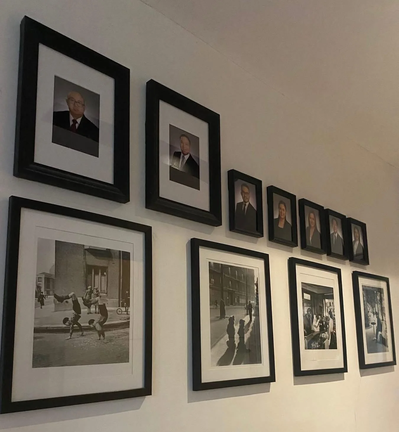 Framed photographs on the wall of Sallan & Jocson Law Offices